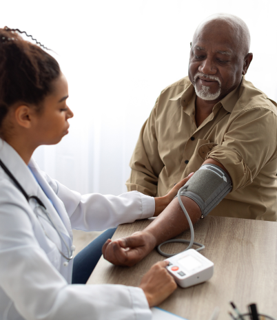 Male 55 or older receiving blood pressure screening from medical professional