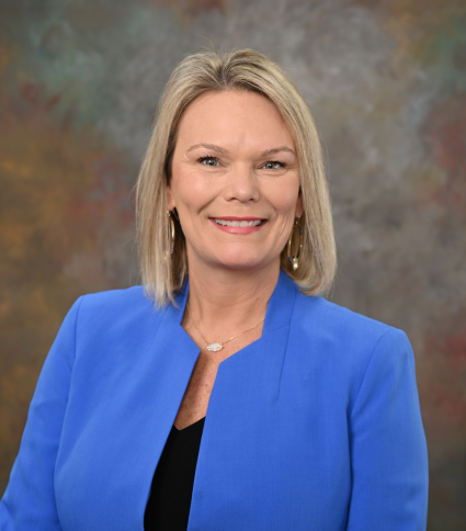 Council Member Michelle Power is wearing a blue jacket. 